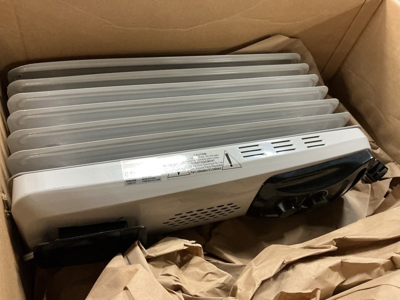 Condition photo showing As Is for Amazon Basics Portable Oil Radiator Heater, Indoor Use, 3 Heat Settings, Over-Heat Protection, ETL-certified Safety, 7 Oil-Filled Steel Fins, 1500W, Tip-Over Protection, 11"D x 14.8"W x 25.2"H, White