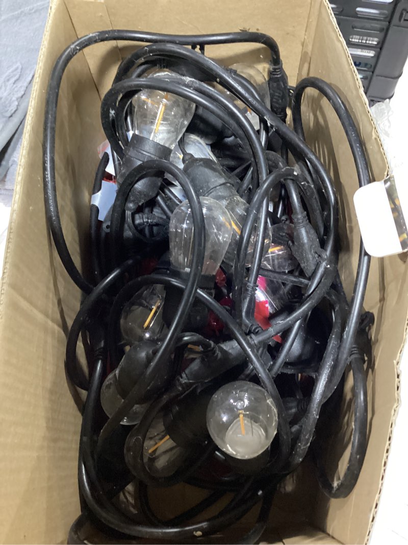 Condition photo showing As Is for better homes & gardens 48-foot outdoor commercial string lights, 24 shatterproof led bulbs, indoor/outdoor use