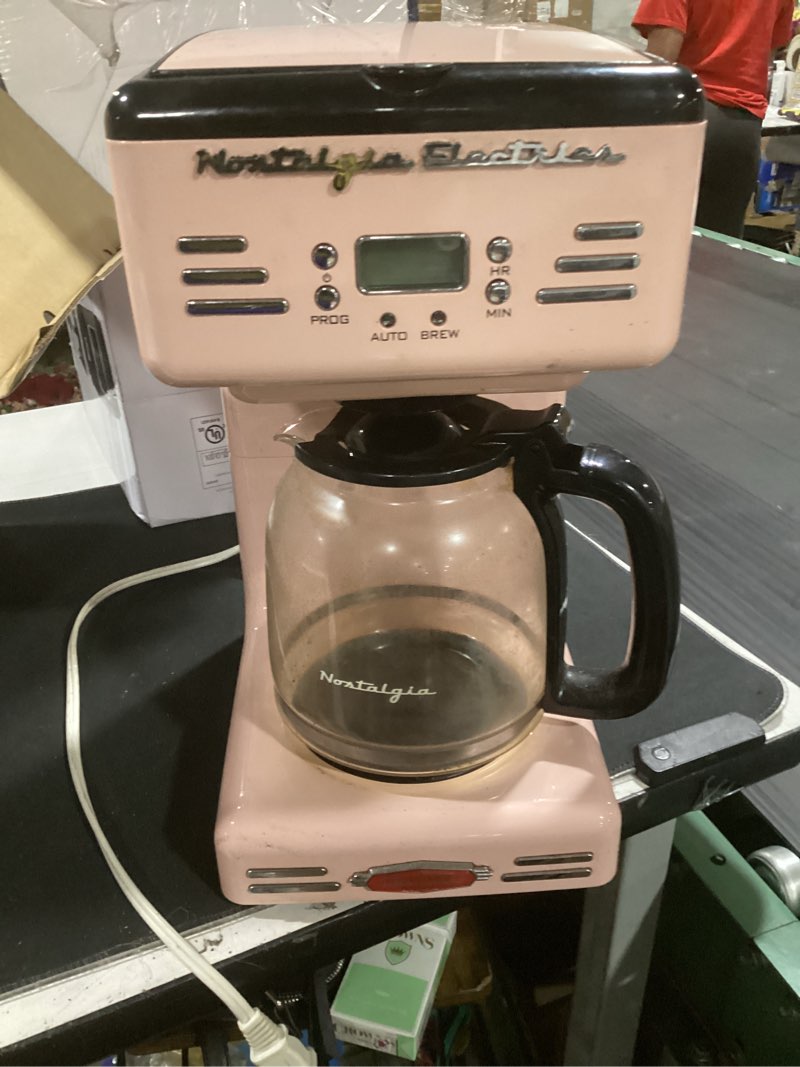 Condition photo showing As Is for nostalgia retro 12-cup programmable coffee maker with led display, automatic shut-off & keep warm, pause-and-serve function, pink