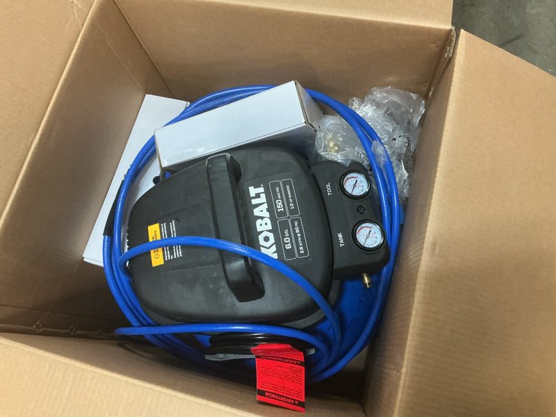 Condition photo showing As Is for kobalt 6-gallon portable electric 150 psi pancake air compressor with accessories included