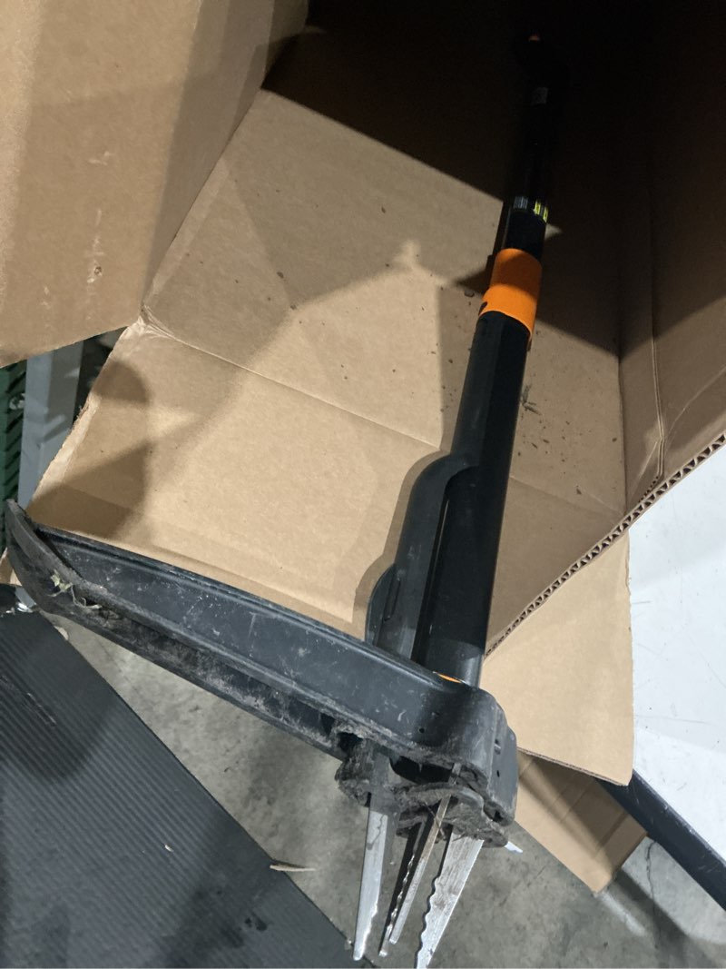 Condition photo showing As Is for fiskars stand-up weed puller tool, 4 serrated stainless steel claws grip roots for permanent removal, reinforced foot platform penetrates tough soil, easy-eject & ergonomic offset handle, 39"