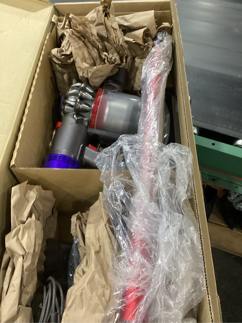 Condition photo showing As Is for NOT TESTED Dyson Outsize Origin Cordless Vacuum, Nickel/Red