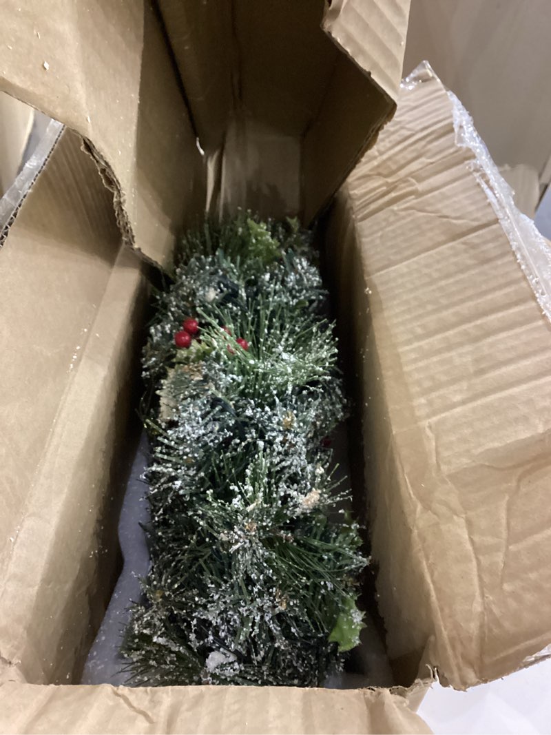 Condition photo showing As Is for Thomas Kinkade 'A Holiday Homecoming' Lighted Musical Wreath, Always in Bloom Collectible with Sculpted Village, LED Lights and 8 Holiday Songs