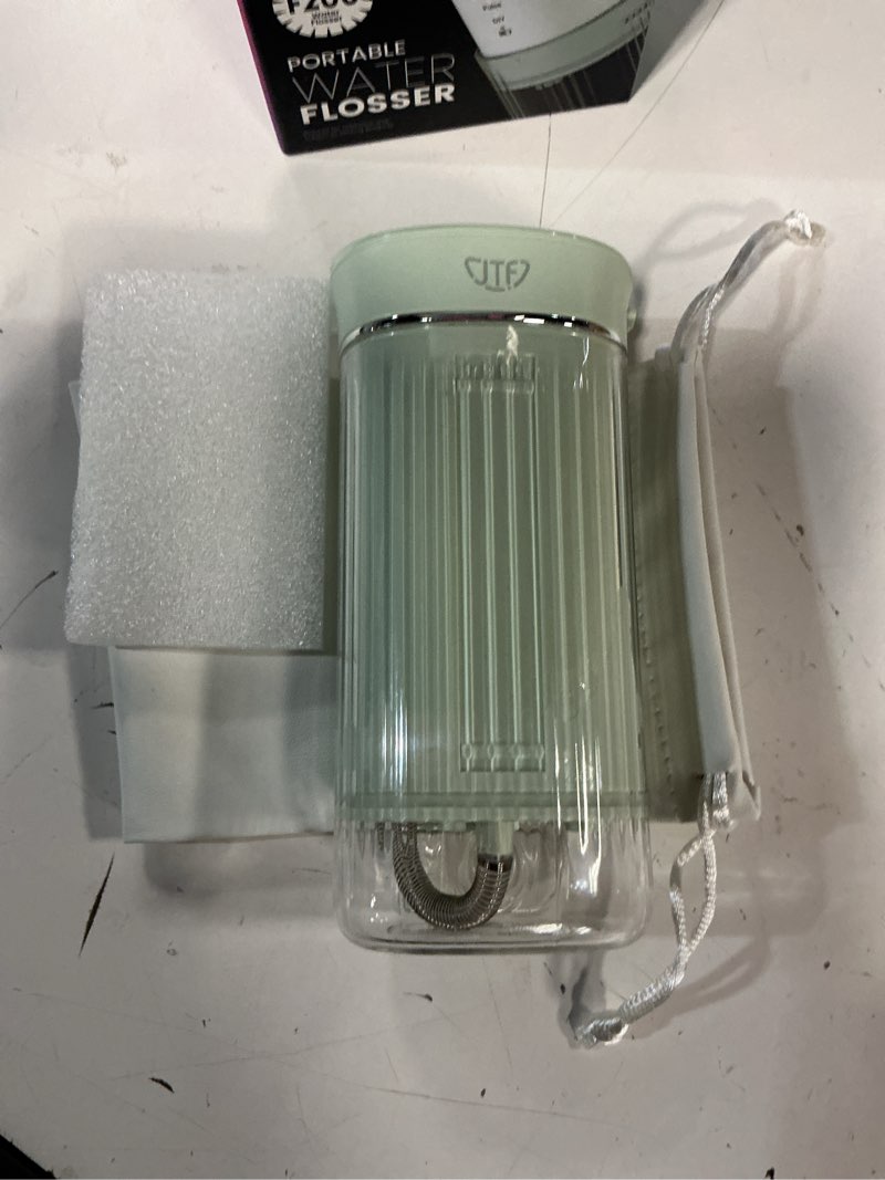 Condition photo showing Good Condition for jtf portable water flosser for travel: compact mini design, 3 modes & 8 diy pressure levels for sensitive teeth & braces - with 5 nozzles & removable 230ml tank, cordless oral irrigator for on-the-go green