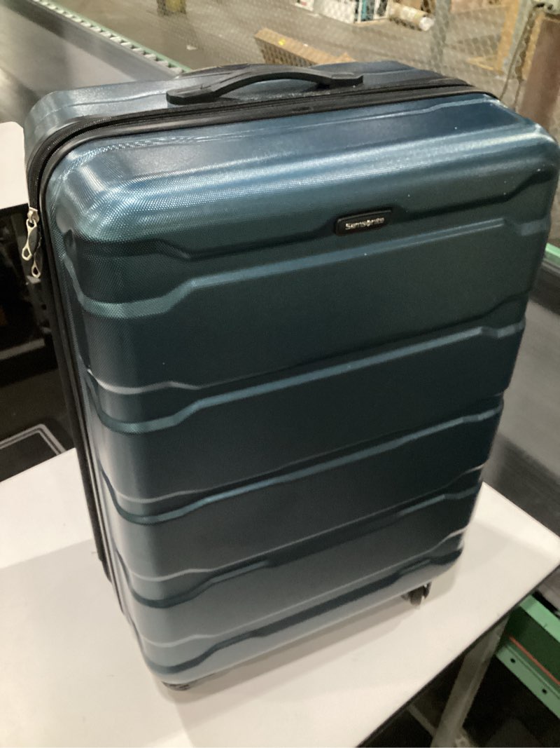 Condition photo showing Good Condition for Samsonite Omni PC Hardside Expandable Luggage with Spinner Wheels, Teal, Checked-Large 28-Inch, USED, HANDLE IS BROKEN