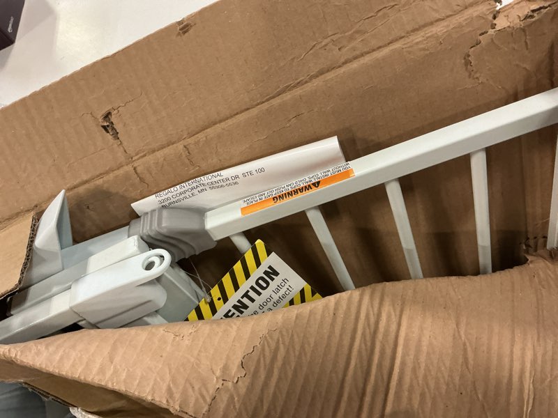 Condition photo showing As Is for Regalo Easy Step Extra Tall Walk Thru Baby Gate, Includes 4-Inch Extension, and 4 Pack of Wall Cups and Mounting Kit, White White 29-36.5"W x 36"H