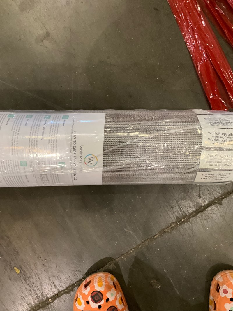 Condition photo showing As Is for area rug