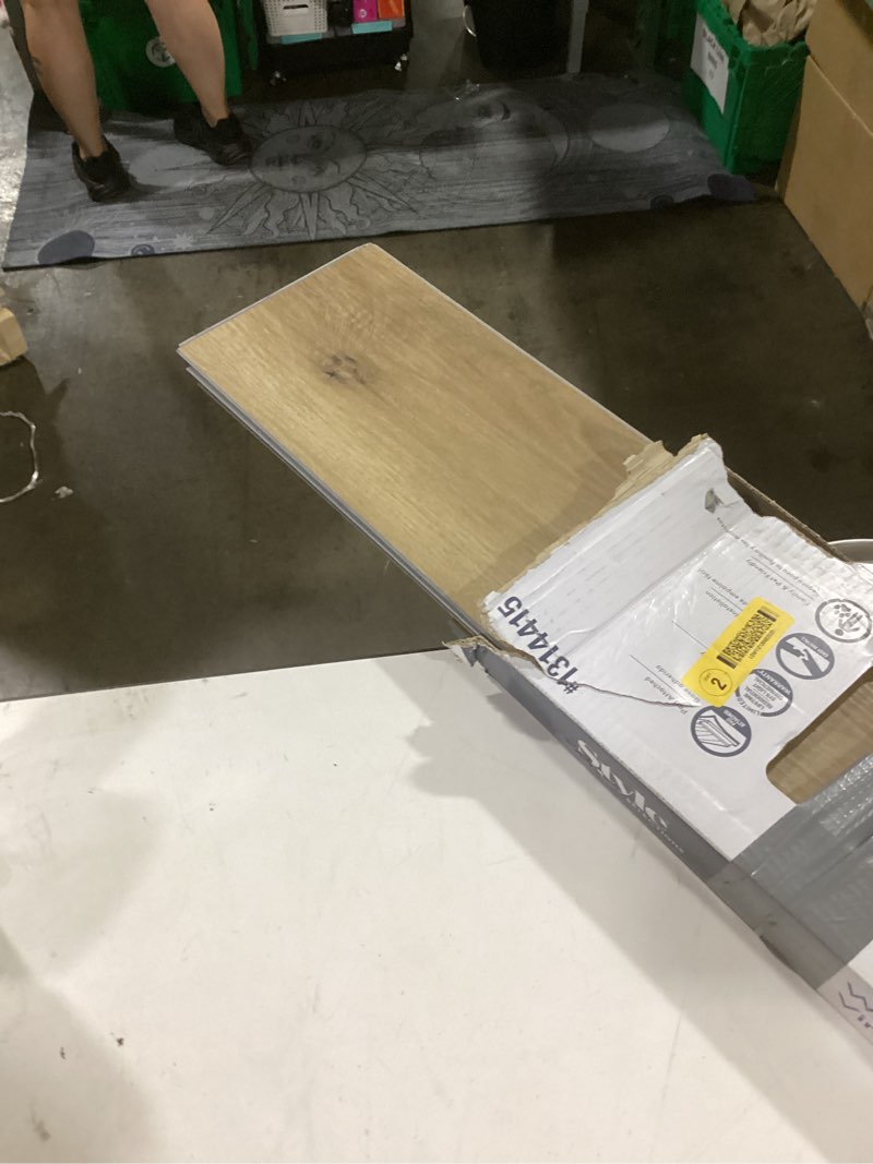 Condition photo showing Good Condition for style selections warm honey oak brown 12-mil x 7-in w x 48-in l waterproof interlocking luxury vinyl plank flooring (23.21-sq ft/ carton)