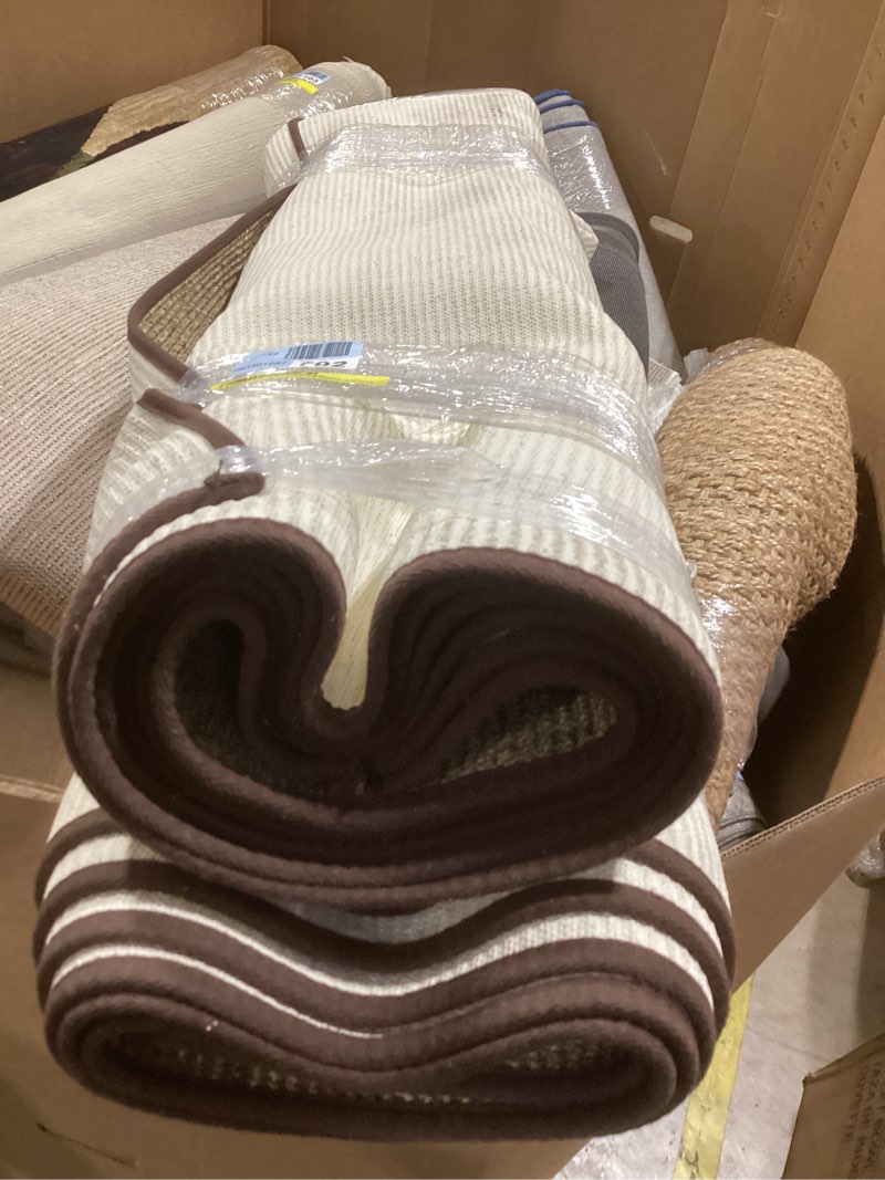 Condition photo showing As Is for Martha Stewart Sisal/Jute Solid Color Rug in Brown