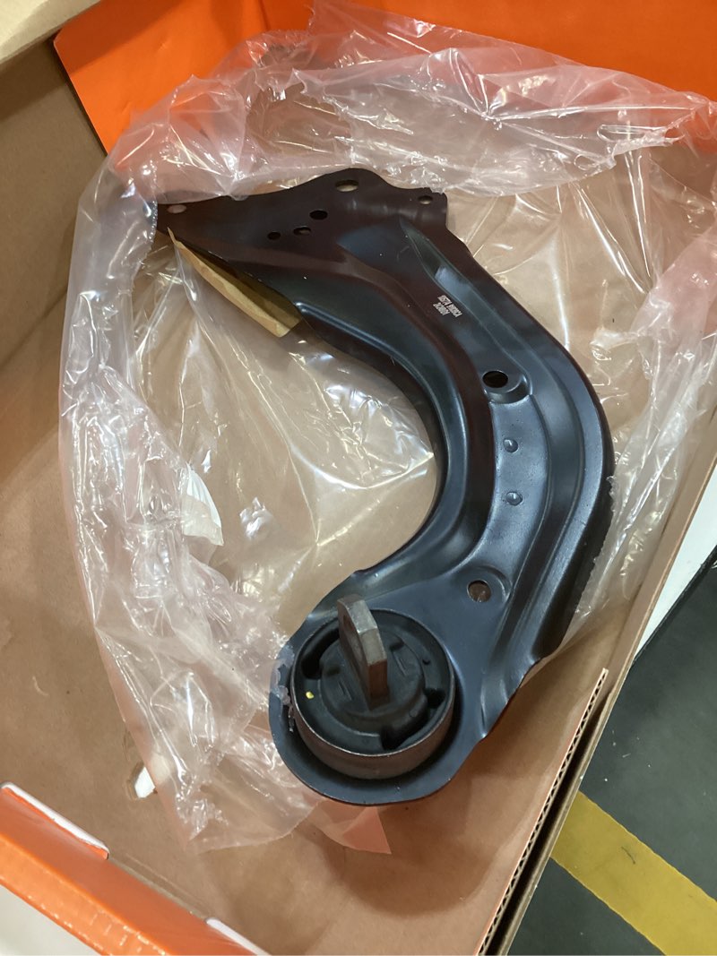 Condition photo showing As Is for dorman 523-294 rear passenger side suspension trailing arm compatible with select chevrolet/gmc models