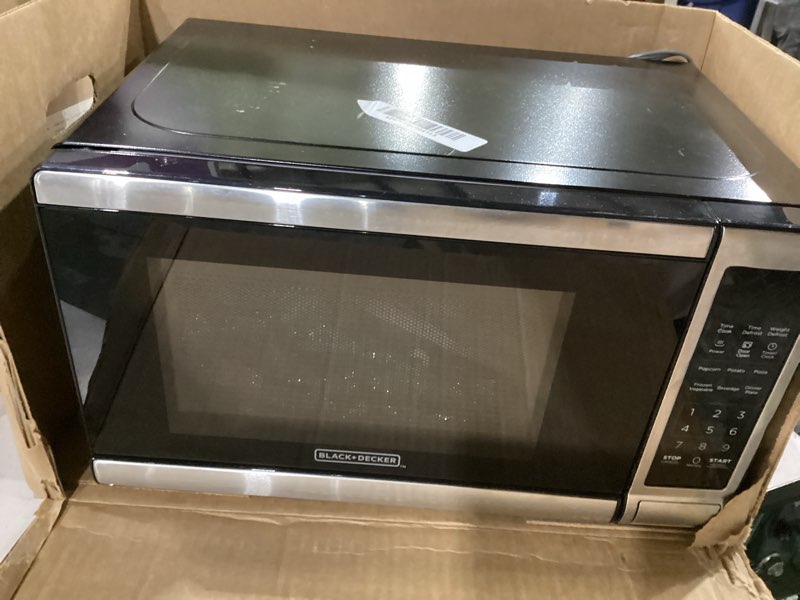 Condition photo showing As Is for not tested****black+decker em720cb7 digital microwave oven with turntable push-button door, child safety lock, 700w, stainless steel, 0.7 cu.ft 0.7 cu. ft.
