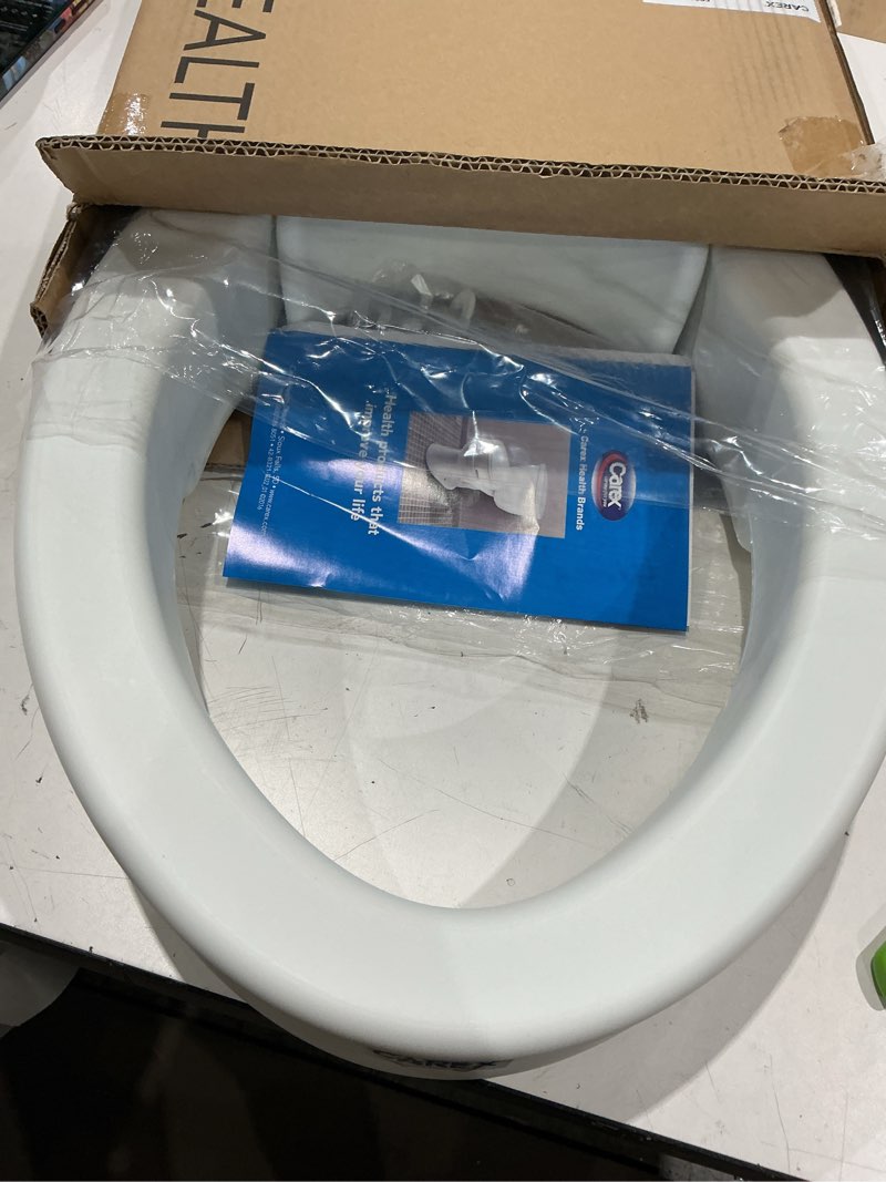Condition photo showing Good Condition for carex elongated hinged toilet seat riser, adds 3.5 inches of height to toilet, 300 pound weight capacity, raised toilet seat