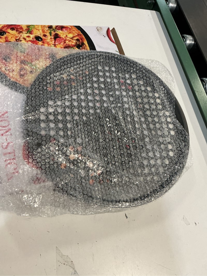 Condition photo showing Good Condition for Non-Stick Pizza Pan with Holes - 13-Inch Perforated Pizza Crisper Carbon Steel Pizza Pan - 1 Round Pizza Trays PFOA PFOS and PTFE Free Pack of 1 Black