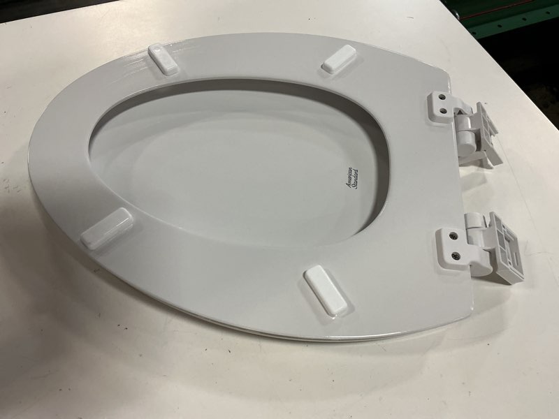 Condition photo showing As Is for american standard 5503a00b.020 transitional elongated toilet seat soft close, white elongated front