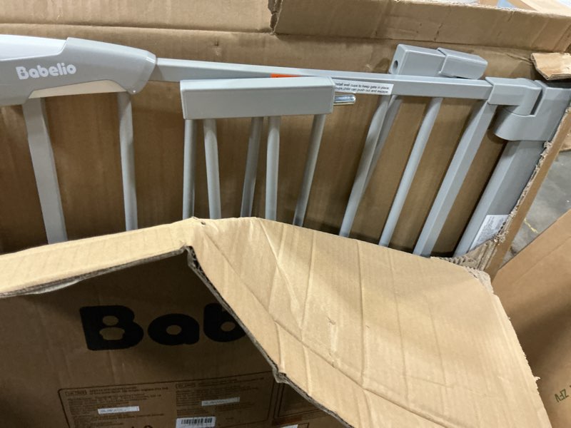 Condition photo showing As Is for BABELIO 36 Inch Extra Tall Baby Gate with Cat Door, 29-40" Metal Pet Door for Stairs, Doorways, House, Auto Close, Easy Walk Thru, Gray Gray 29-40" Wide, 36" Tall
