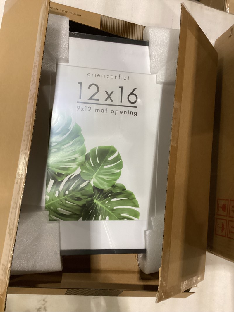 Condition photo showing Good Condition for Americanflat 12x16 Metal Picture Frame with Tempered Glass - Use as 9x12 Frame with Mat or Display 12x16 Photo Without Mat - Brooklyn Collection - Picture Frames for Wall Display - Black Black 12X16