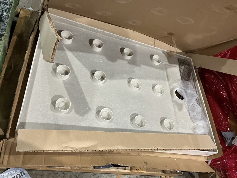 Condition photo showing As Is for ckb 48 in x 32 in shower base, with linear drain cover and reversible, pre-sloped acrylic and fiberglass shower pan with removable flanges, carrara white 48 in x 32 in_zero threshold carrara marble white