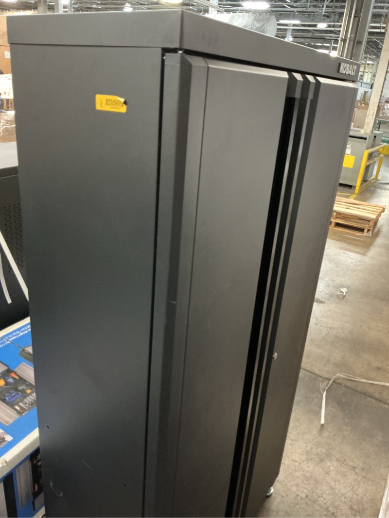 Condition photo showing As Is for kobalt 36-in w x 72-in h x 18.5-in d freestanding steel garage cabinet in black