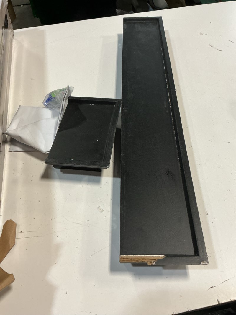 Condition photo showing As Is for melannco floating wall shelves for bedroom, living room, bathroom, kitchen, nursery, set of 4, black, 4 count black set of 4 arlington (missing parts)