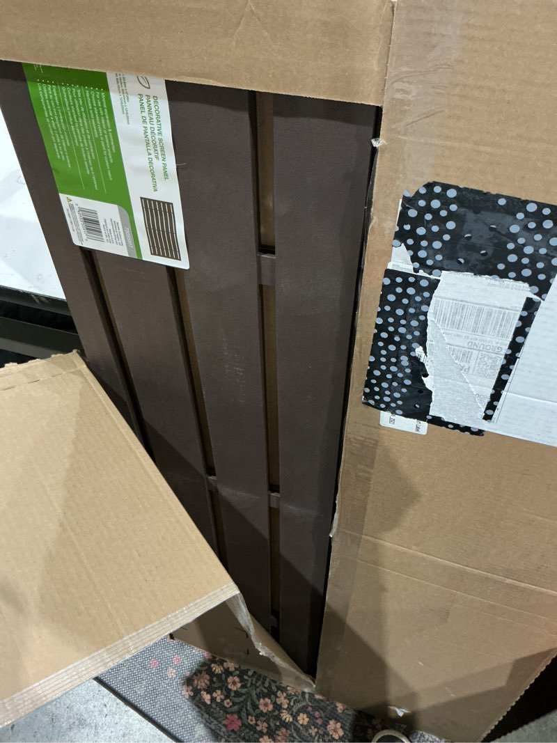 Condition photo showing As Is for 2 ft. x 4 ft. boardwalk umber decorative screen panel