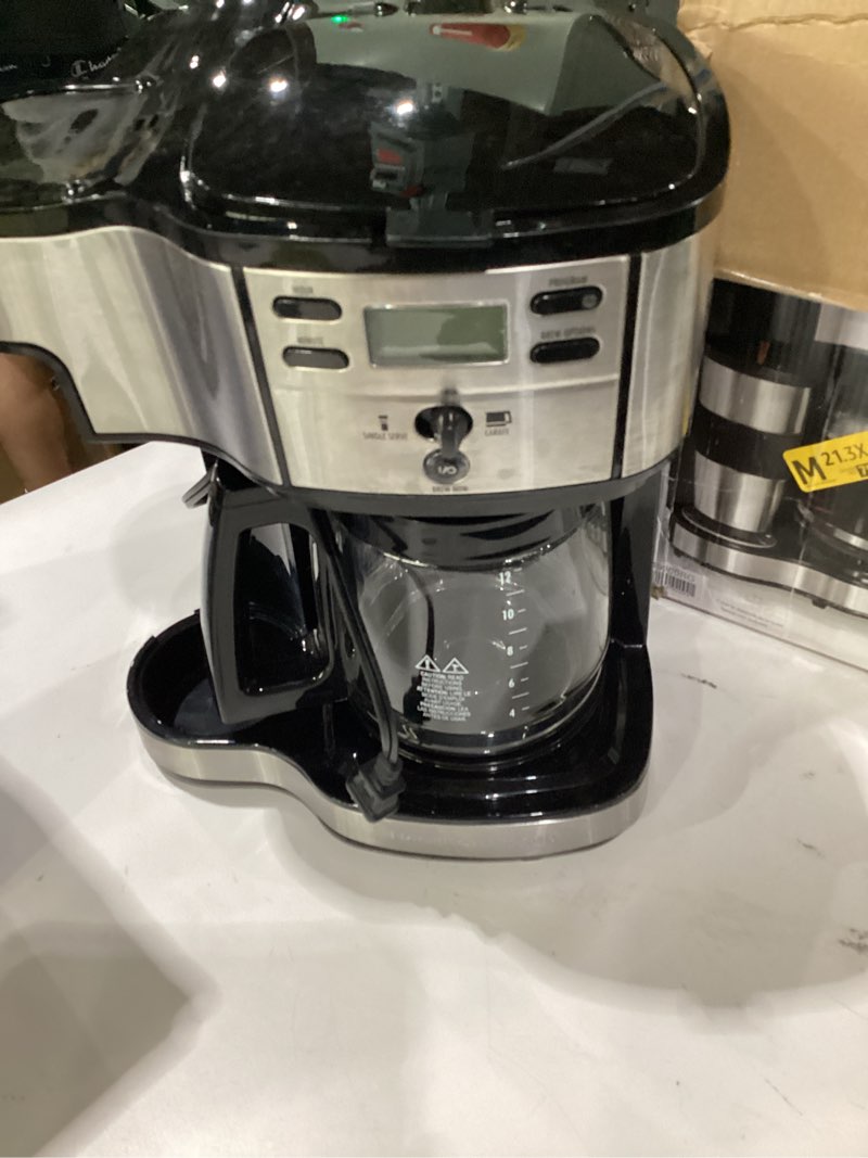 Condition photo showing As Is for hamilton beach 2-way programmable coffee maker, 12 cup glass carafe and single serve coffee maker, black with stainless steel accents, 49980rg 12 cup black, not tested, incomplete