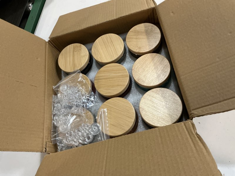 Condition photo showing New/Like New for 10 oz embossed glass candle container with bamboo lids and labels, clear candle jars for making candles, sun moon stars design - pack of 9 (multicolor)