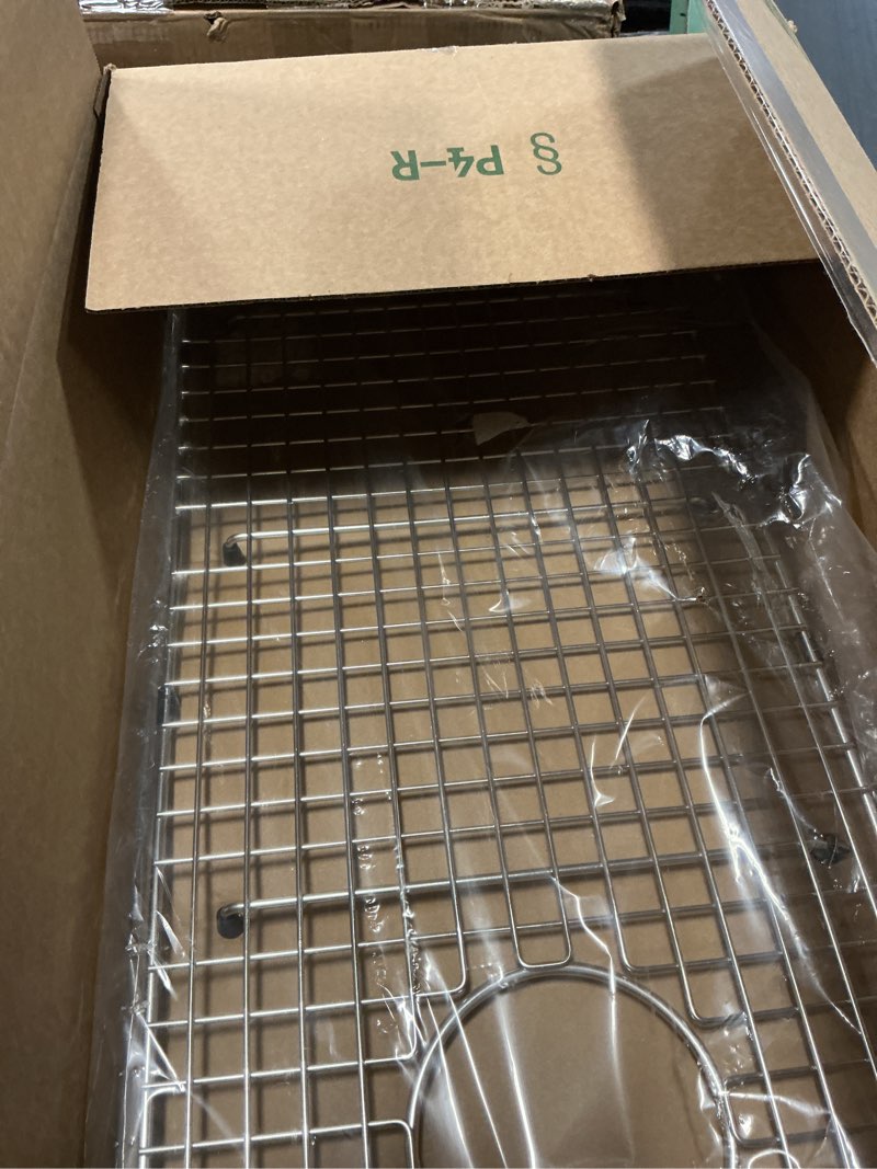 Condition photo showing Good Condition for serene valley sink bottom grid 25-7/8“ x 14-1/16", side drain with corner radius 3/8",svh2614s