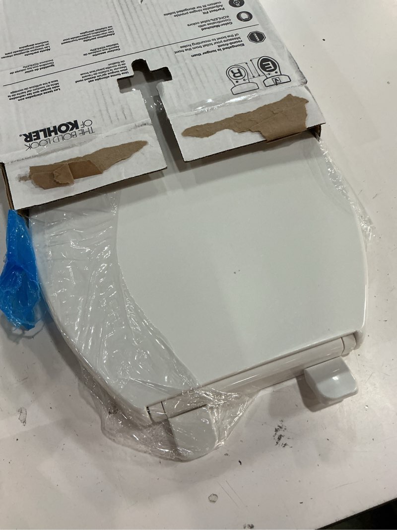 Condition photo showing As Is for kohler 20110-0 brevia, slow close toilet seat, elongated toilet seat, grip-tight bumpers quick-attach hardware, white white elongated quiet-close