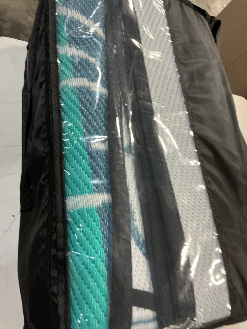 Condition photo showing Good Condition for garvee 9x12 outdoor waterproof rug, floral outdoor area rug?reversible plastic straw patio rug, portable camping mat for rv, picnic, beach, balcony, garden & camping black&blue blackblue 9' x 12' (rectangular)