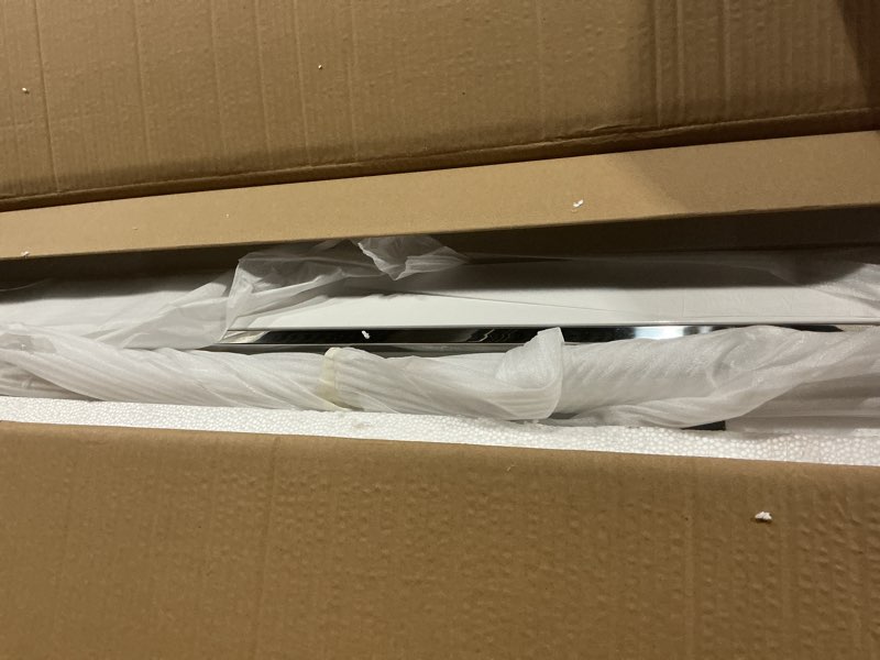 Condition photo showing As Is for Benjara Cofffee Zen 48 Inch Coffee Table, Rectangular Lacquer Top, Steel Frame, White and Chrome