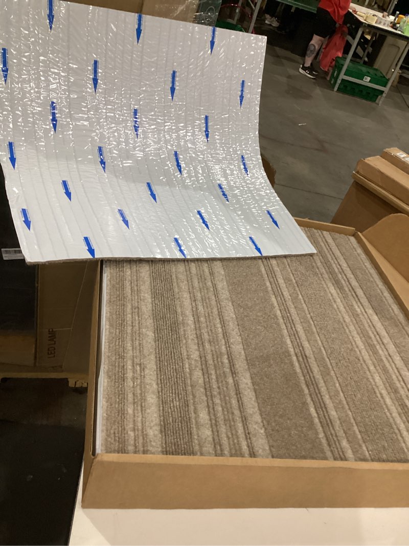 Condition photo showing Good Condition for mohawk home 24" x 24" indoor/outdoor 0.25" pile height, peel and stick carpet tile, brown polyester, (15 tiles) (60 sqft/box) taupe brown couture