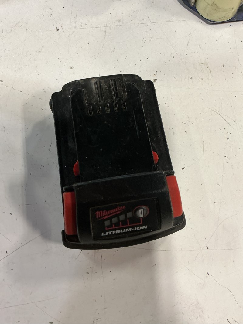 Condition photo showing As Is for milwaukee m18 1.5 ah 18v red lithium ion battery 48.11.1815 for impact drill