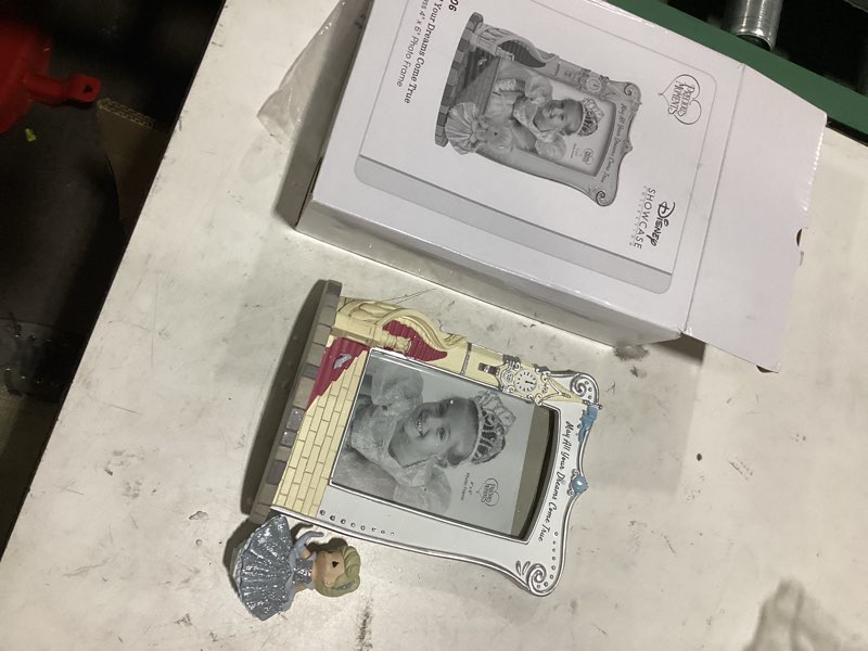 Condition photo showing As Is for **figurine unglued from frame** precious moments disney cinderella themed crystal clear photo frame - ideal for gift-loving women