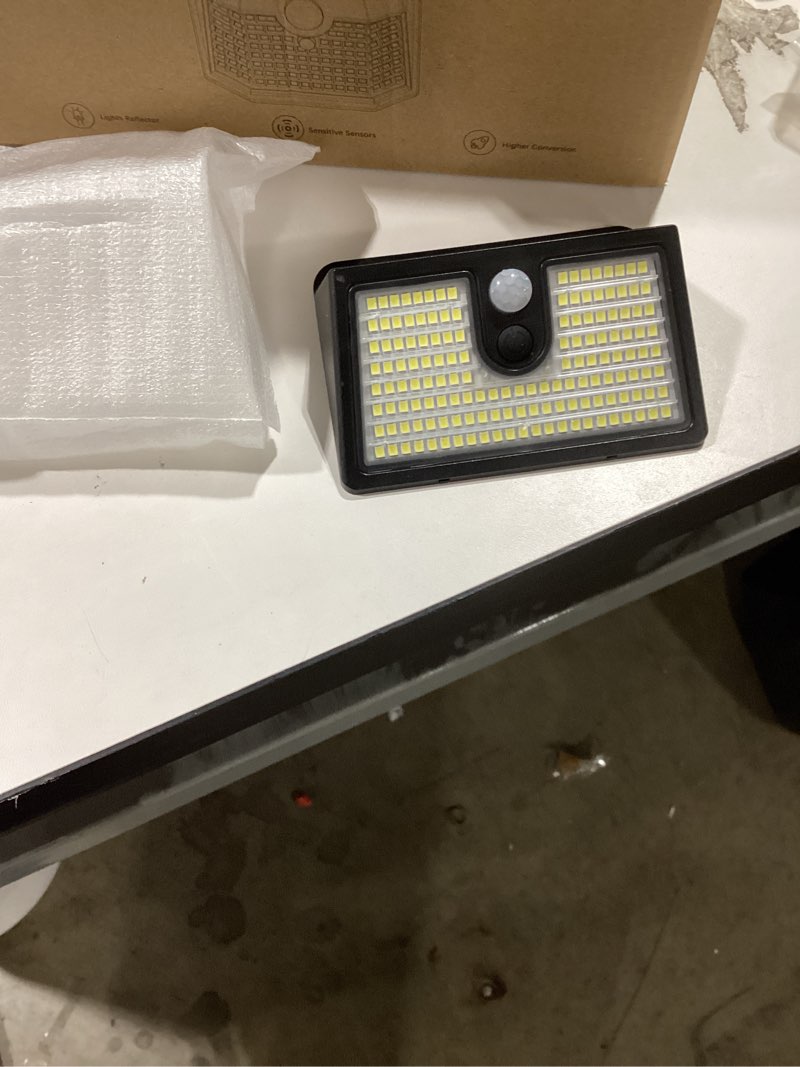 Condition photo showing Good Condition for [6 Packs] Solar Motion Sensor Outdoor Lights, Super Bright Solar Lights Outdoor Waterproof, 3 Lighting Modes Security Wall Light for Outside Walking Dog Fence Backyard Deck Garden Door Step Garage Cool White 6 Pack