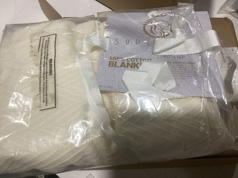 Condition photo showing New/Like New for superior metro all-season cotton blanket, woven blanket for couch, bed, bedding, farmhouse, home essentials, cute and cozy bohemian blankets, herringbone weave, throw size, ivory throw ivory