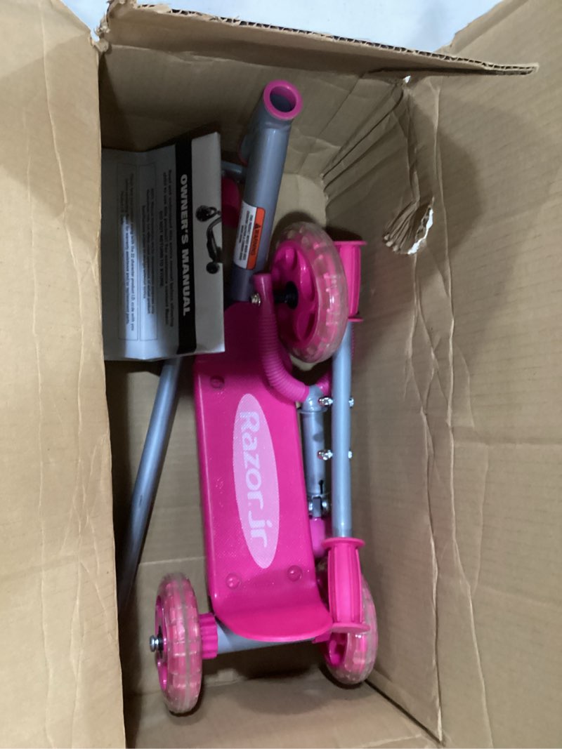 Condition photo showing As Is for razor jr. lil’ kick – 3-wheel kick scooter for younger children (ages 3+), max rider weight 44 lb (20 kg) pink scooter