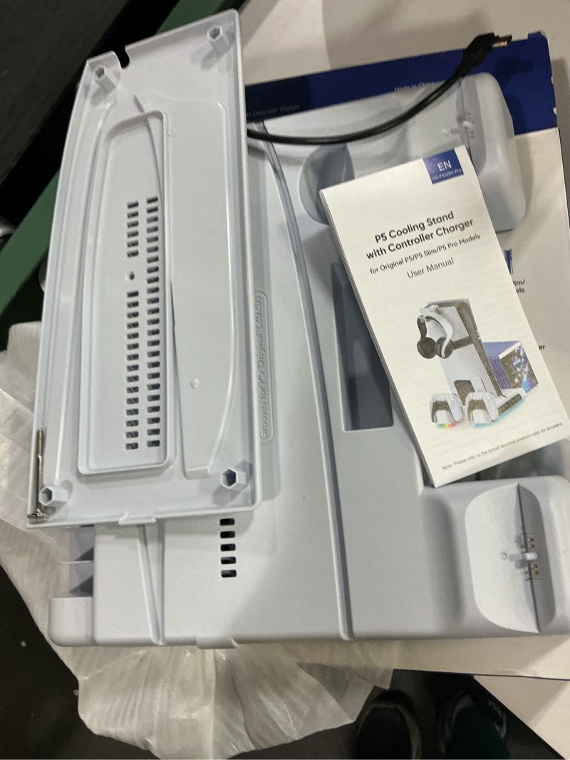 Condition photo showing As Is for p5 cooling stand with controller charger 