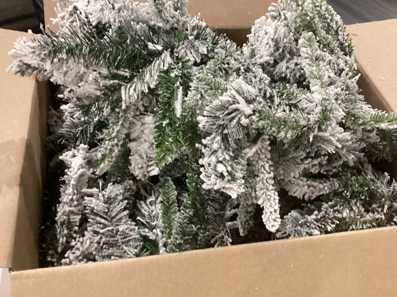 Condition photo showing As Is for *similar to stock item*  9 ft x 10 in flocked berkshire spruce garland, 170 tips, pine cones