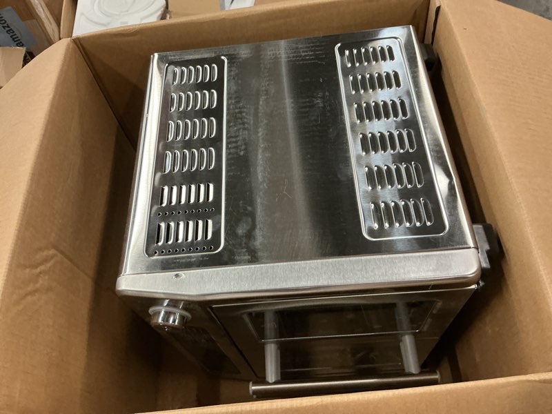 Condition photo showing As Is for Dan - Emeril Lagasse Extra Large French Door Air Fryer Toaster Oven Combo, 24 Cooking Functions and Digital Controls, 7 Accessories Included, Stainless Steel Finish, 26QT Capacity