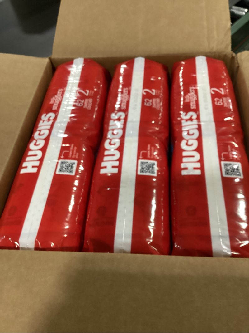 Condition photo showing New/Like New for huggies size 2 diapers, little snugglers baby diapers, size 2 (12-18 lbs), 186 count (3 packs of 62), packaging may vary