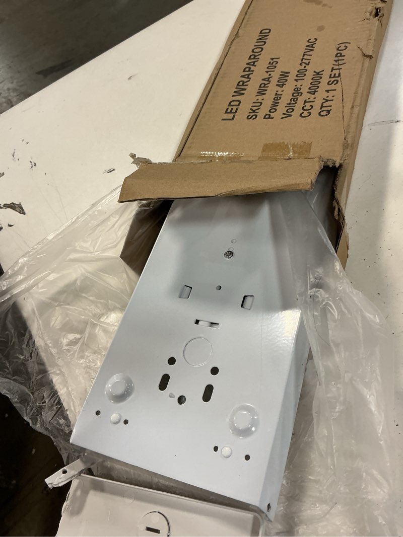 Condition photo showing Good Condition for hykolity 4FT LED Wraparound Light, 40W, 4400lm, 4000K, [2-lamp 32W Fluorescent Equiv.], 4 Foot LED Wrap Light Fixture, Flush Mount Office Ceiling Light for Garage, Office, Kitchen, ETL Listed 4000K - 40W 4FT 40W