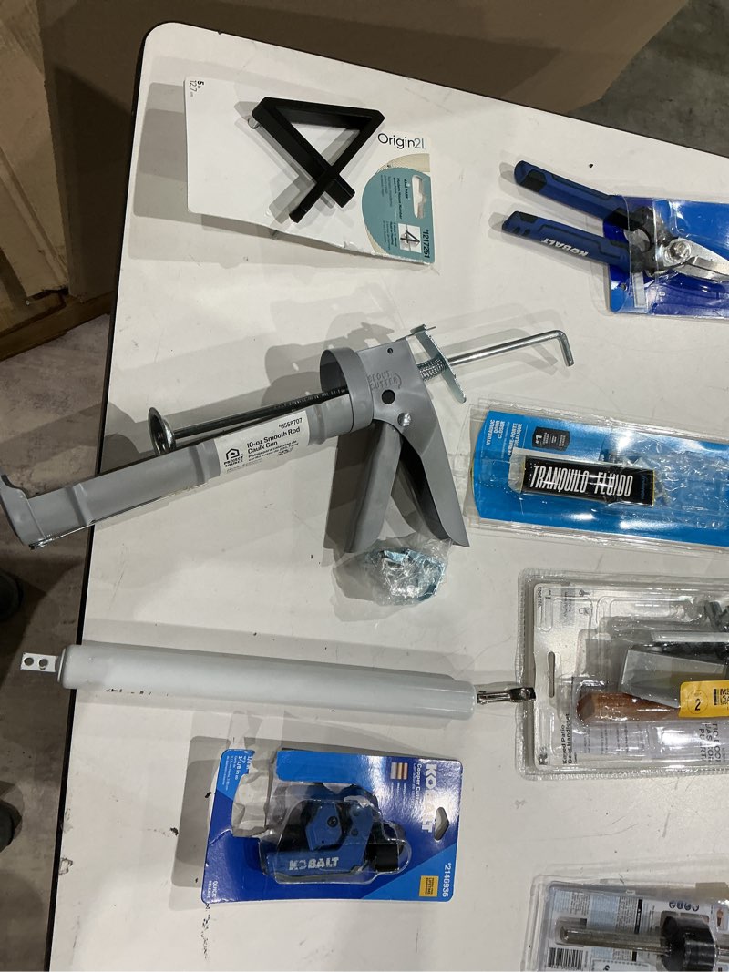 Condition photo showing As Is for assorted home improvement lot (small tools, screw, home accessories, etc.)