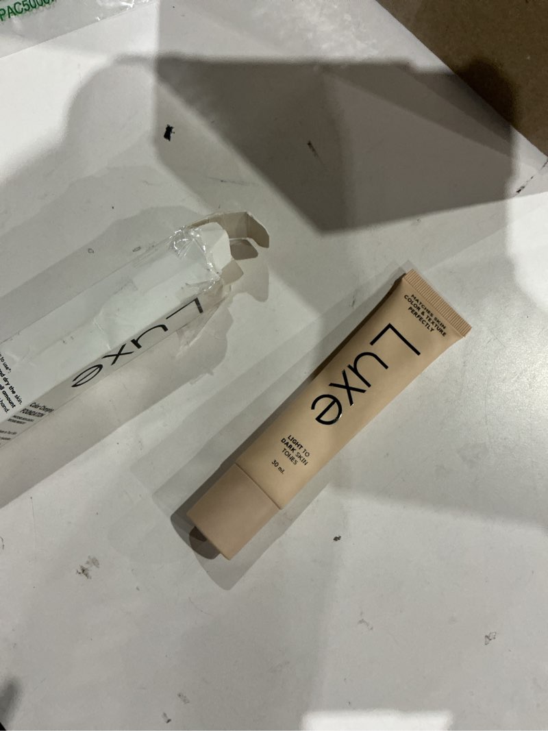 Condition photo showing As Is for luxe research color changing foundation for women – instantly adapts to your skin tone – buildable light-to-medium coverage – 12-hour wear – natural dewy finish (medium dark)