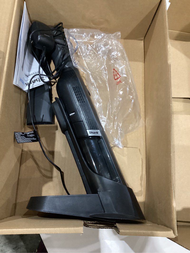 Condition photo showing As Is for shark wandvac cordless hand vac, lightweight, versatile and portable at 1.4 lbs., powerful suction for pet hair, charging dock, one-touch empty for car & home, duster crevice tool, black, wv201bk