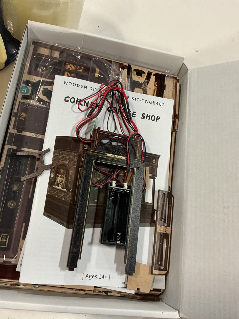 Condition photo showing Good Condition for CUTEBEE Book Nook Kit - DIY Miniature House Coffee Shop Dollhouse Kit for Adults, Booknook Tiny House Bookshelf Decor 3D Wooden Puzzle, Gifts for Family, Friends (Corner Coffee Shop)