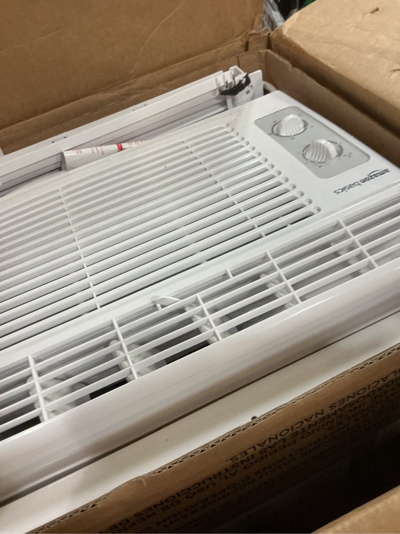 Condition photo showing As Is for amazon basics 5000-btu window air conditioner with quiet operation, up to 150 sqf, cool and fan functions, washable filter, adjustable window kit, intuitive mechanical controls, for small room, white white 5000 btu