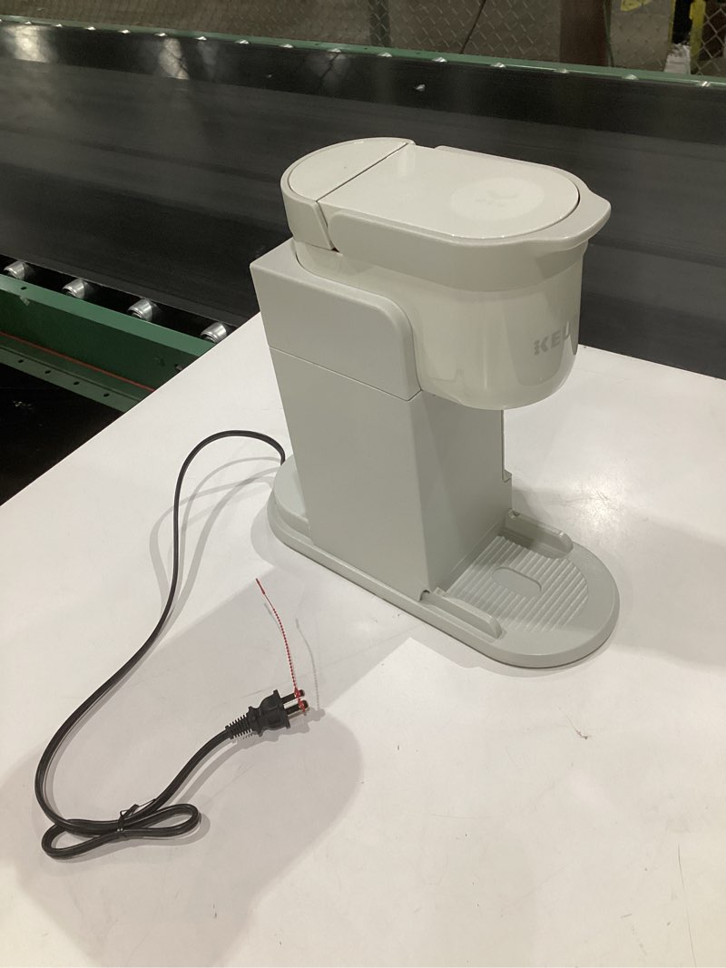 Condition photo showing As Is for keurig,  model unknown, not tested, incomplete parts, damaged