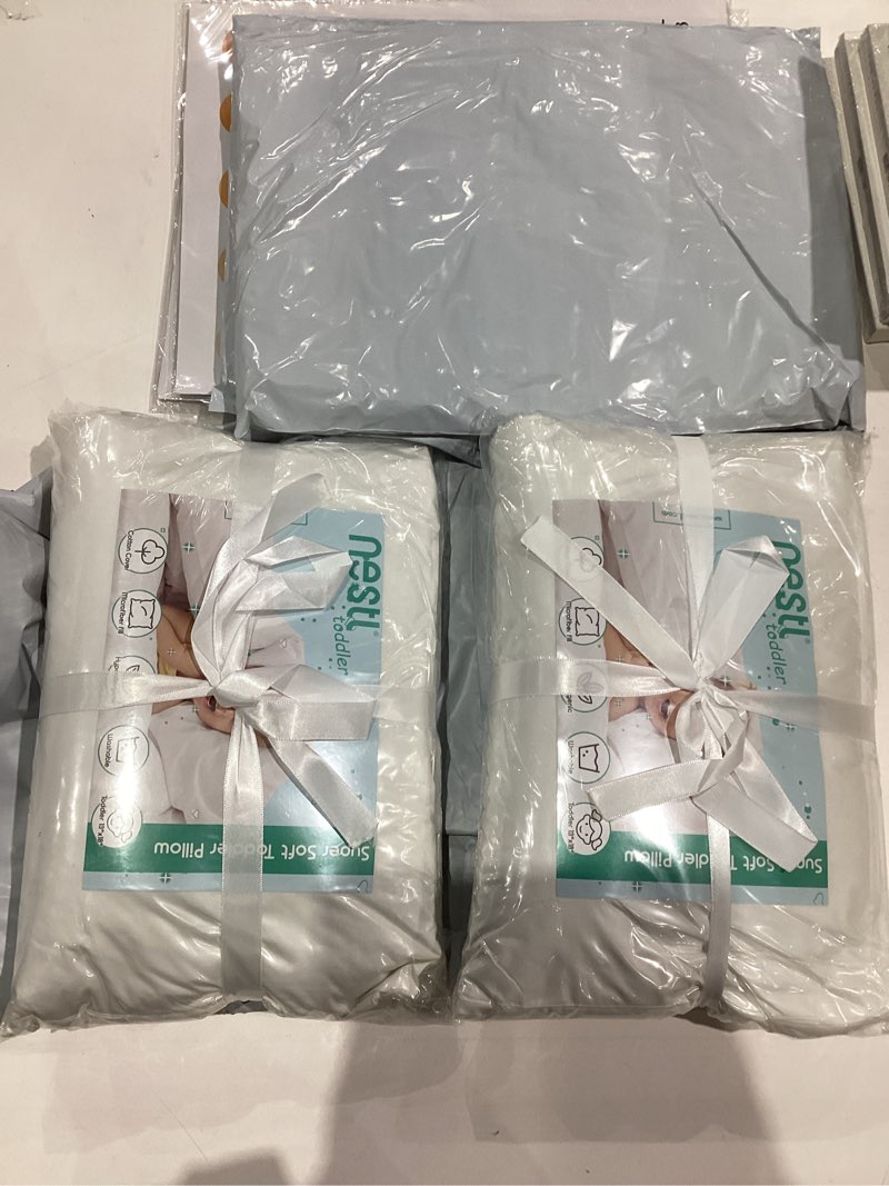 Condition photo showing As Is for Nestl 4 Pack Toddler Pillow for Sleeping 13 x 18, Small Kids Pillow for Travel, Car, School, Nap, & Toddler Bed, Machine Washable Soft Cotton Toddler Pillow 2 Year Old and Up - White 4 Pack (13x18) there is only 2.