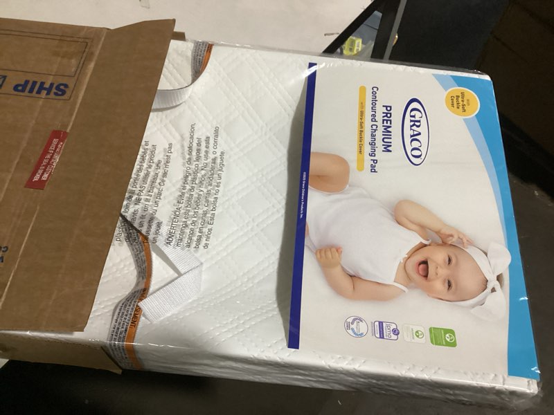 Condition photo showing As Is for Graco Premium Contoured Changing Pad – GREENGUARD Gold Certified, Water-Resistant, Ultra-Soft Buckle Cover, Contoured Baby Changing Pad, Fits Most Standard-Size Changing Toppers, Non-Skid Bottom