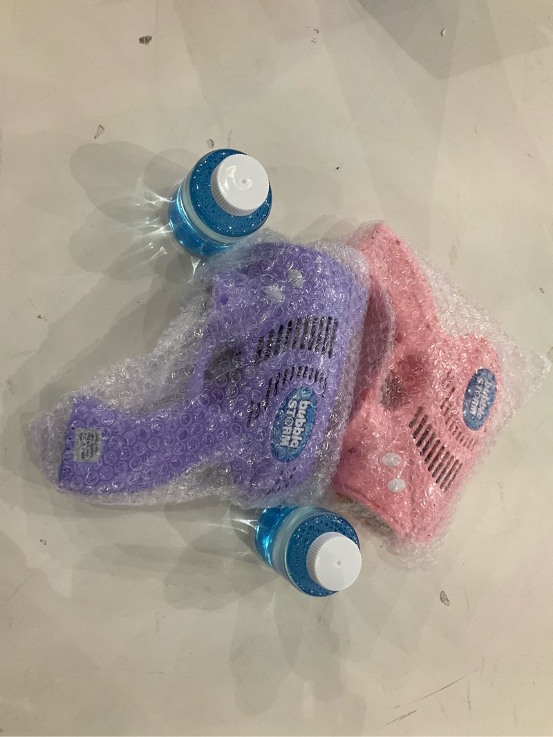 Condition photo showing New/Like New for JOYIN 2 Bubble Guns with 2 Bottles Refill Solution, Bubble Machine Gun for Kids, Toddlers, Party Favors, Summer, Outdoors Activity, Wedding, Easter, Birthday Gift Pink+purple